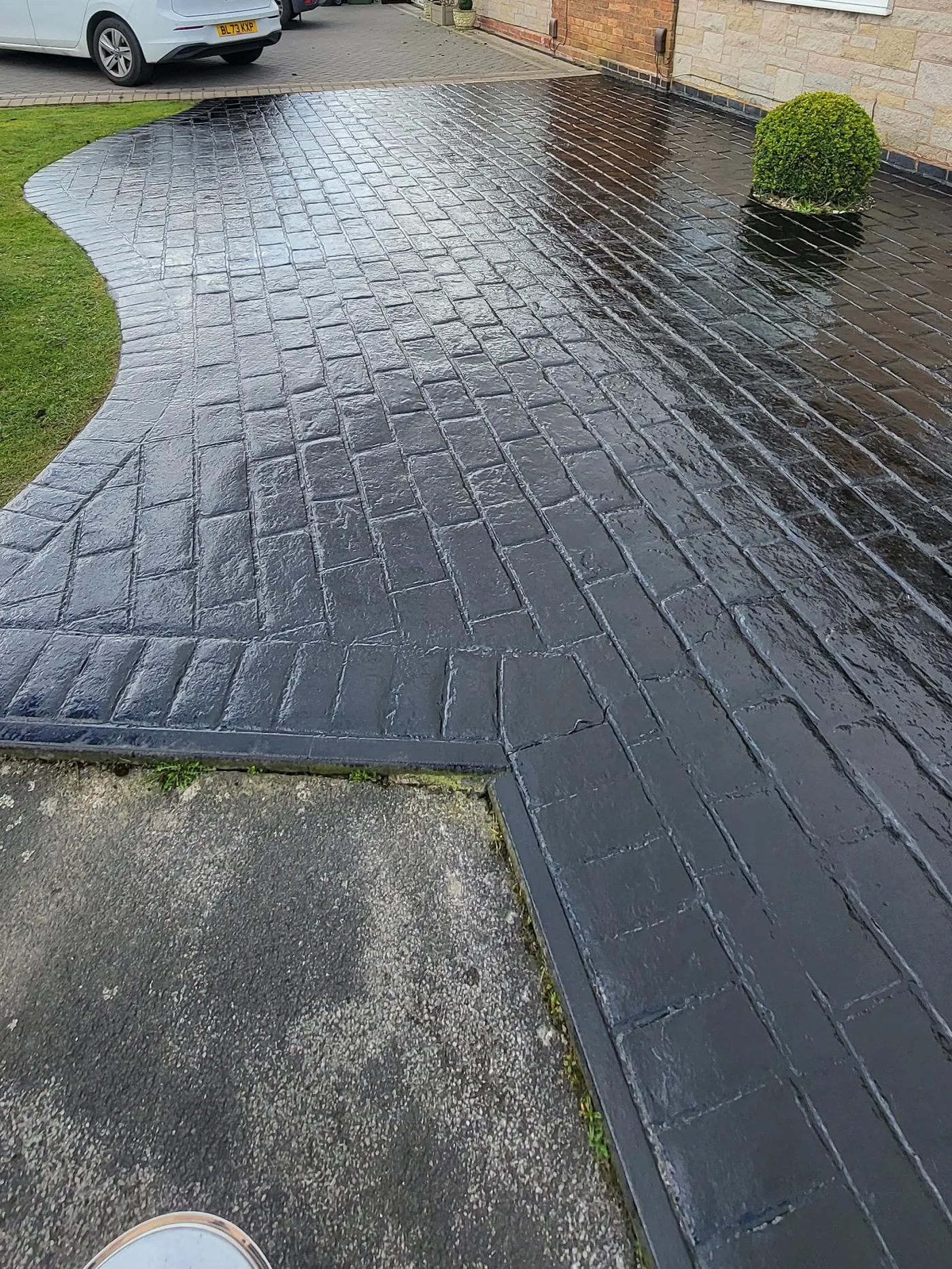 Imprinted concrete driveway, re-sealed